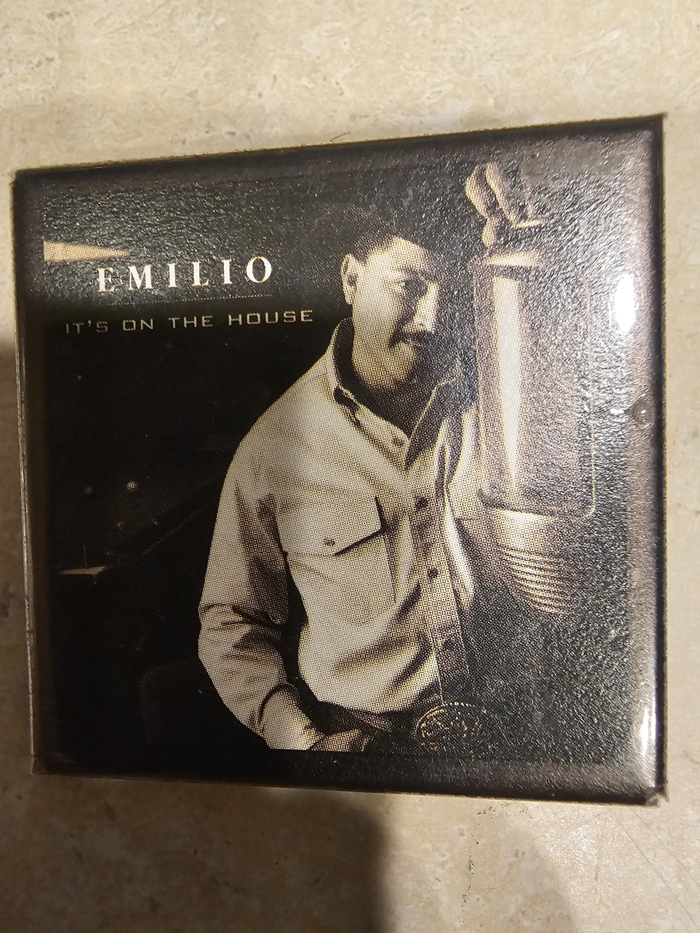 Emilio " ITS ON THE HOUSE" square button